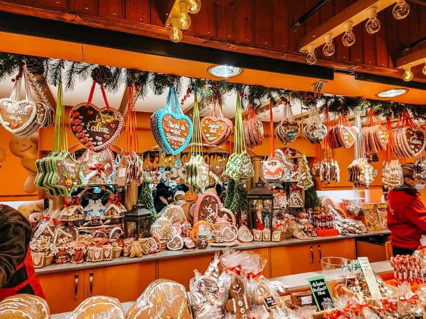 Numerous gingerbread treats and decorations are displayed for sale at a Strasbourg Christmas market.