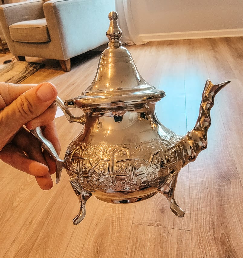a closeup of a silver Morocca tea pot. 