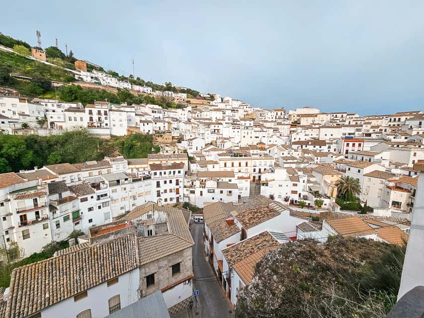 Mirador del Carmen offers a view over white buildings with brown and tan tile roofs in Setenil de las Bodegas.