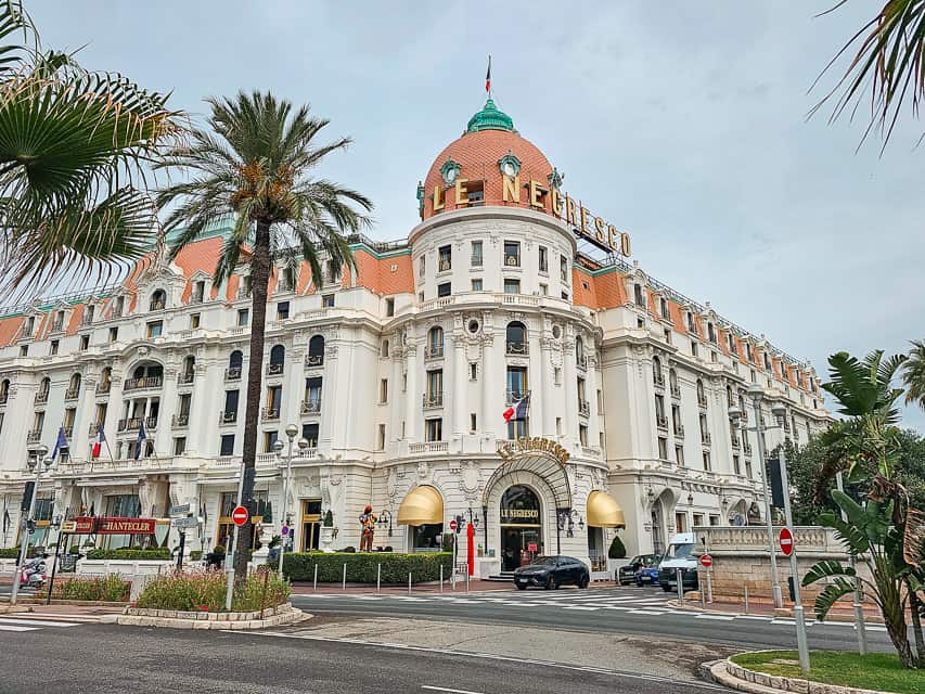 Hotel Le Negresco  sits on the corner of a boardwalk with sculpted white and coral wood. It is one of the best things to do in Nice. 